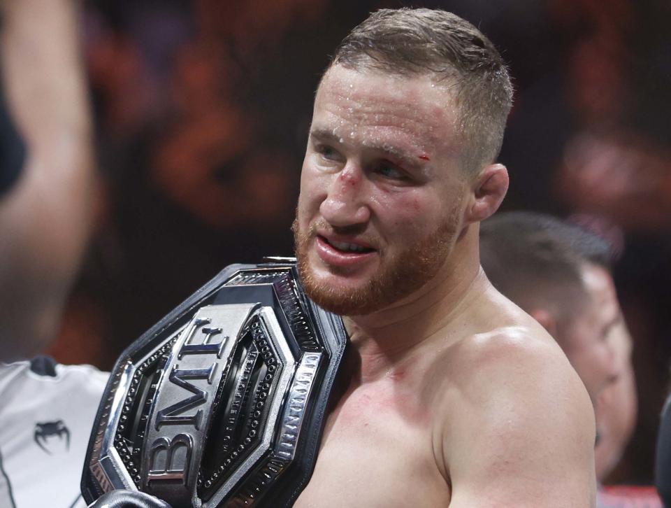 Jul 29, 2023; Salt Lake City, Utah, USA; Justin Gaethje (blue gloves) reacts to defeating Dustin Poirier (red gloves) during UFC 291 at Delta Center. Mandatory Credit: Jeff Swinger-USA TODAY Sports