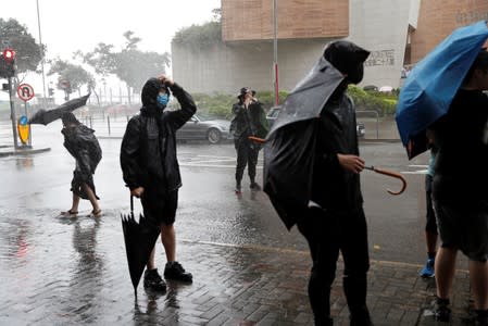 Protesters gather outside the Eastern Courts to support the arrested anti-extradition bill protesters who face rioting charges, as the typhoon Wipha approaches in Hong Kong