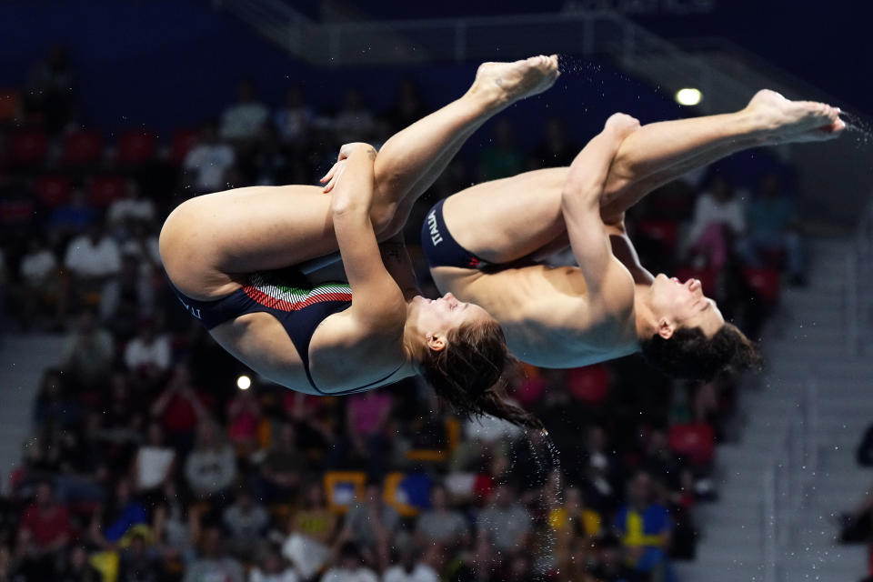 Chiara Pellacani and Matteo Santoro of Italy compete during the mixed 3m synchronised diving final at the World Aquatics Championships in Doha, Qatar, Saturday, Feb. 10, 2024. (AP Photo/Hassan Ammar)