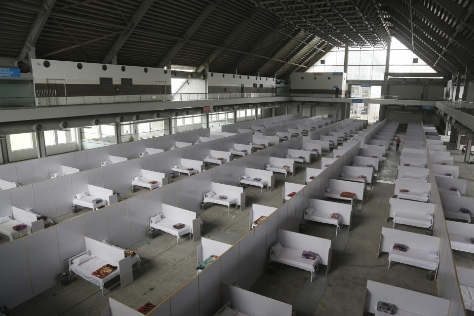 An emergency hospital is set up with nine hundreds beds for coronavirus infected patients, in the Expo Center, Lahore, Pakistan, Thursday, March 26, 2020. The virus causes mild or moderate symptoms for most people, but for some, especially older adults and people with existing health problems, it can cause more severe illness or death. (AP Photo/K.M. Chaudhry)