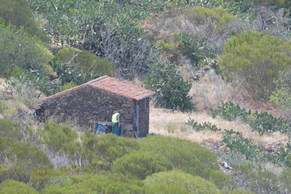 A member of a search and rescue team searches near Jay Slater’s last known location on Sunday (PA Wire)