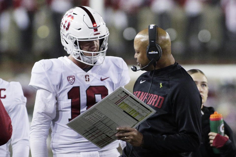 Stanford coach David Shaw, right, speaks with quarterback Tanner McKee during the second half of the team's NCAA college football game against Washington State, Saturday, Oct. 16, 2021, in Pullman, Wash. Washington State won 34-31. (AP Photo/Young Kwak)