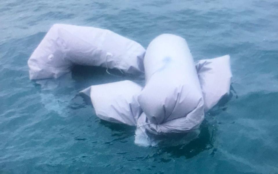 The remains of the dinghy that capsized in the Channel on Wednesday night, killing 27 people