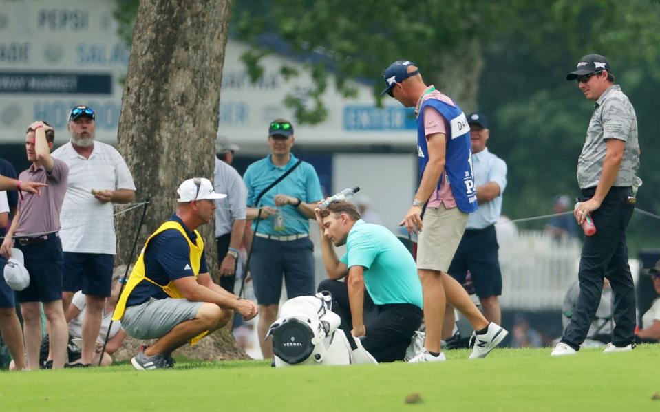 Pain for Aaron Wise after being hit by Cameron Smith's erratic tee shot at Southern Hills - GETTY IMAGES