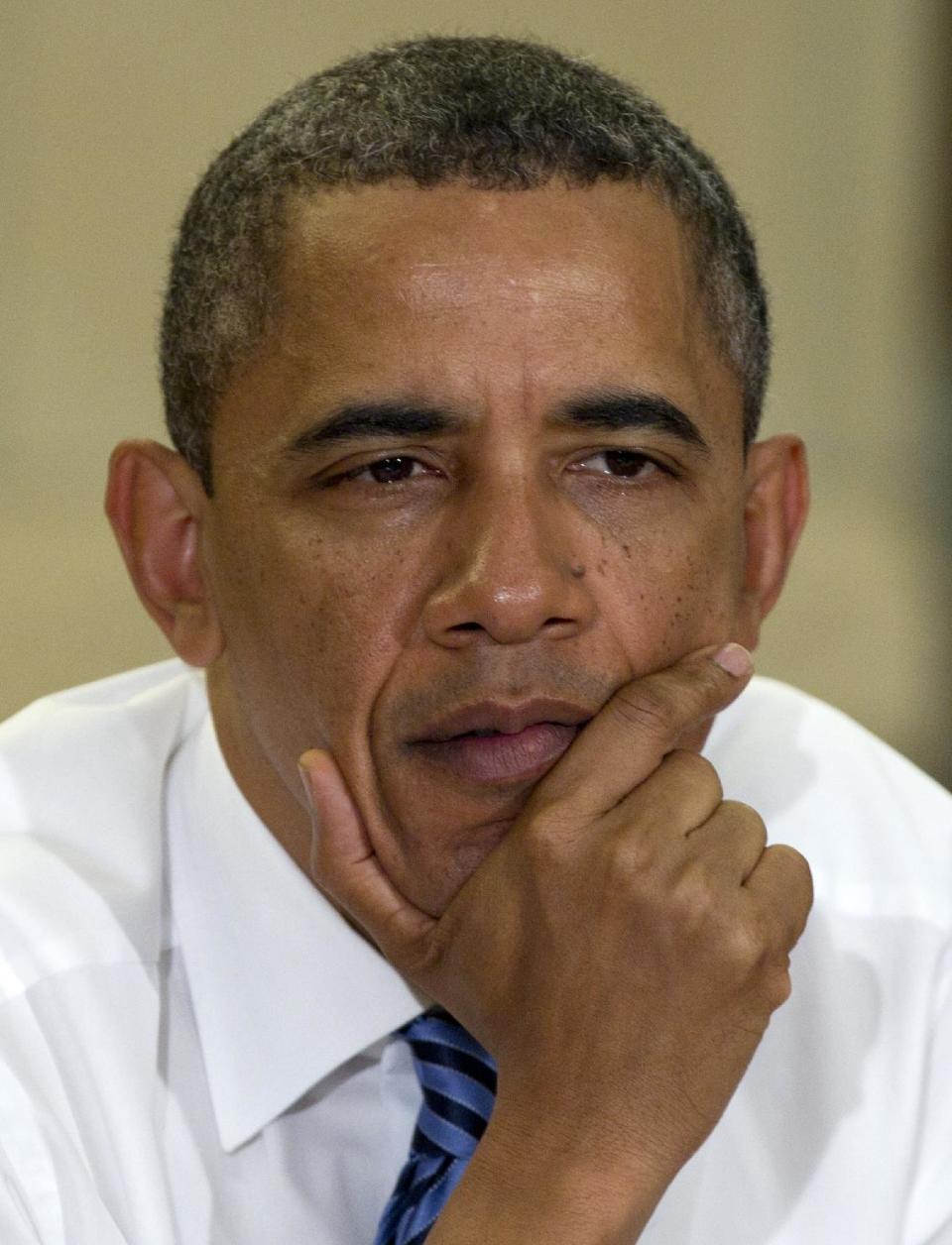 President Barack Obama participates in a roundtable discussion with students at the University of Iowa, Wednesday, April 25, 2012, in Iowa City, Iowa. (AP Photo/Carolyn Kaster)