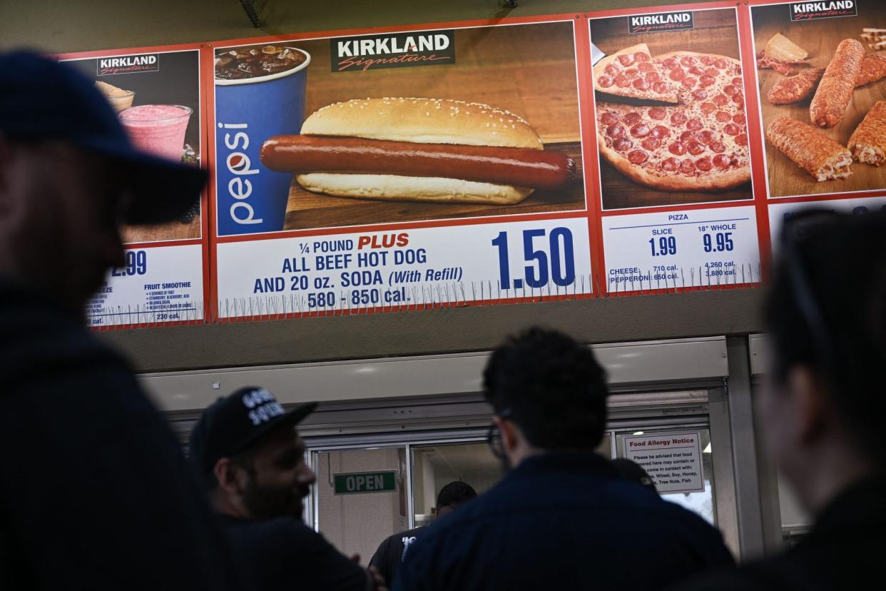 Customers wait in line at a Costco food court.