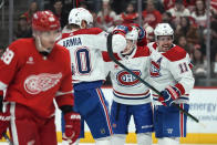 Montreal Canadiens right wing Brendan Gallagher (11) celebrates his goal with Joel Armia (40) and Lane Hutson (48) in the first period of an NHL hockey game Monday, April 15, 2024, in Detroit. (AP Photo/Paul Sancya)