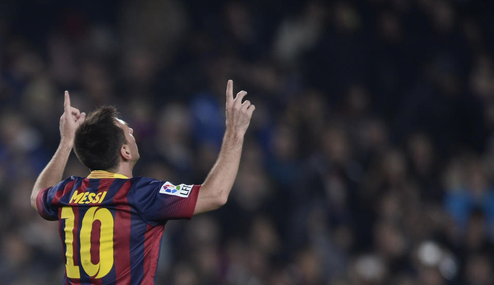 FC Barcelona's Lionel Messi, from Argentina, reacts after scoring against Getafe during a Copa del Rey soccer match at the Camp Nou stadium in Barcelona, Spain, Wednesday, Jan. 8, 2014. (AP Photo/Manu Fernandez)