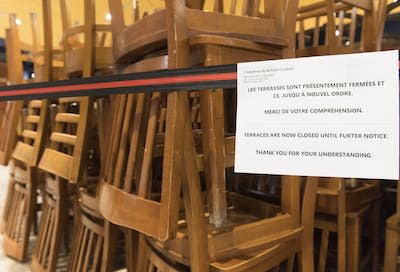 A sign notifying customers of a closed terrace is shown at food court in Montréal in March 2020 as COVID-19 cases rose in Canada. THE CANADIAN PRESS/Graham Hughes