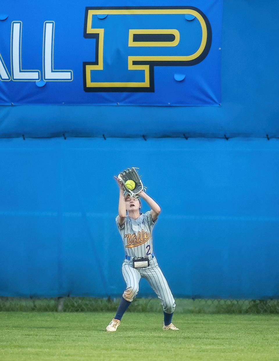 Pflugerville outfielder Paige Fulgham catches a deep fly ball from an Elgin batter during Tuesday night's 5-0 win at Pflugerville High School.