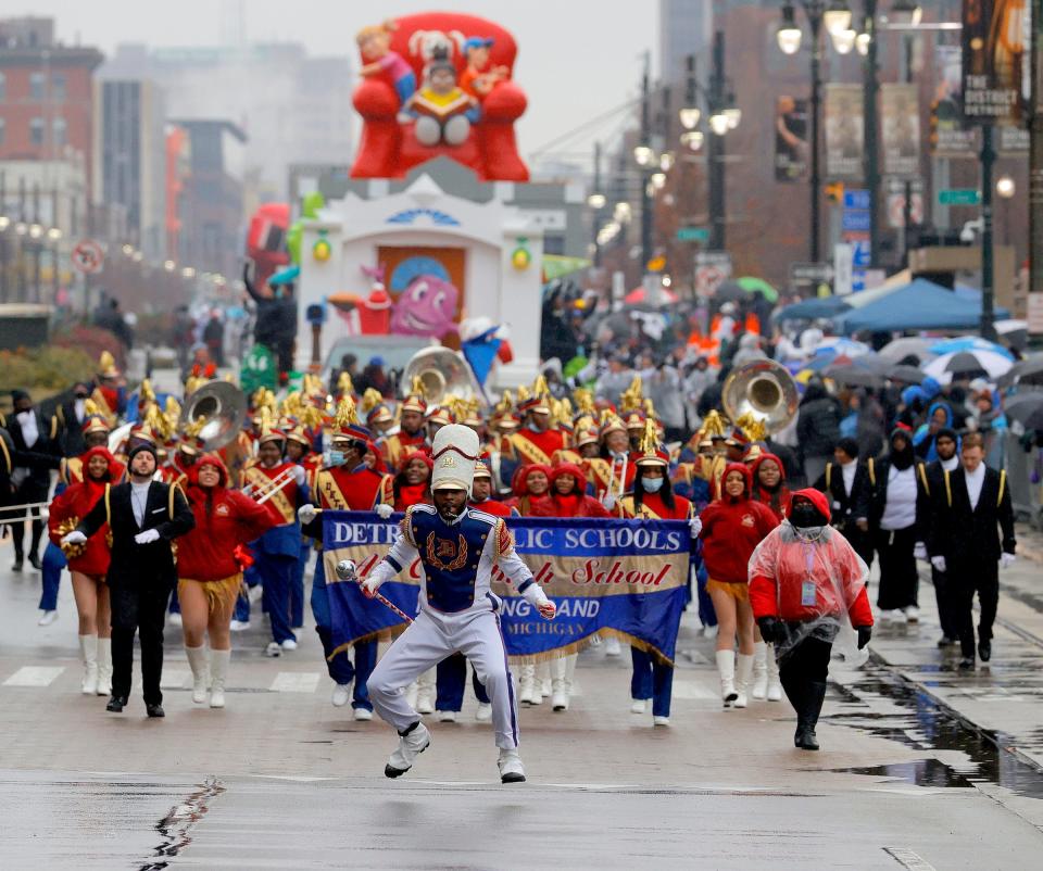 The Detroit Public Schools All-City High School Marching Band performs in front of the Fox Theatre during America's Thanksgiving Parade on Woodward Avenue in Detroit on Nov. 25, 2021.