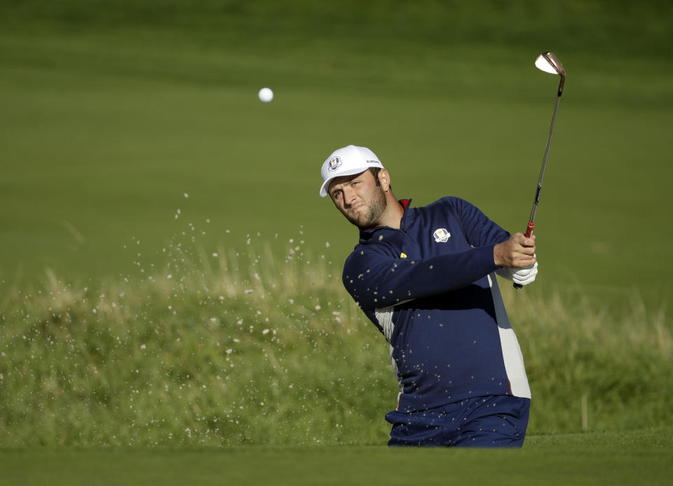 Europe's Jon Rahm plays from a bunker near the 10th green during a practice round at Le Golf National in Guyancourt, outside Paris, France, Tuesday, Sept. 25, 2018. The 42nd Ryder Cup will be held in France from Sept. 28-30, 2018 at Le Golf National. (AP Photo/Matt Dunham)