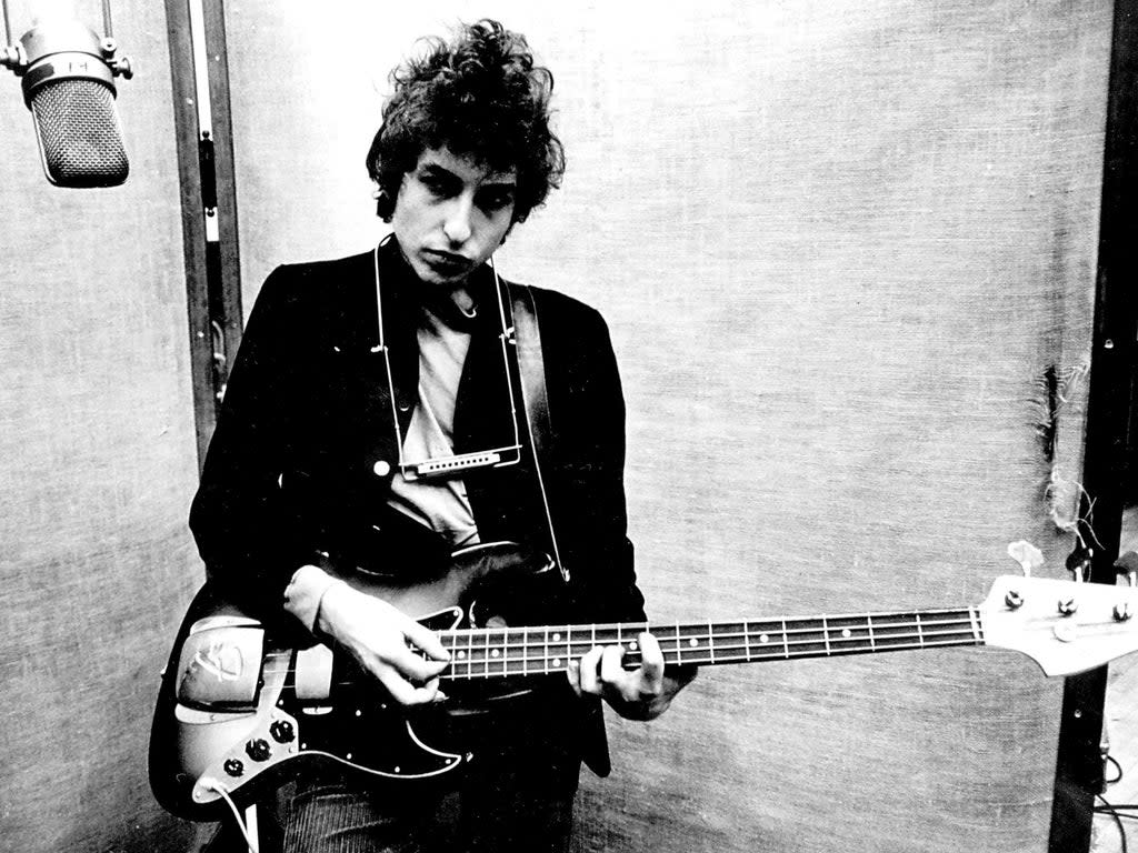 Bob Dylan pictured in 1965 – four years after he released his debut album (Dm/Globe Photos via ZUMA Wire/Shutterstock)