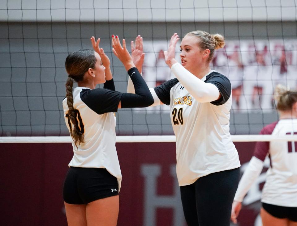 Bishop Verot senior Ella Portu (right) high fives sophomore Sidney Blackwood (left) in a game against First Baptist Academy on Thursday, Oct. 5, 2023.