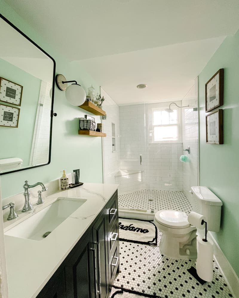 Green painted bathroom after renovation.