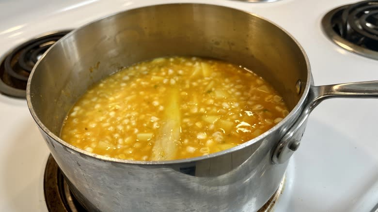 potatoes corn stock in saucepan