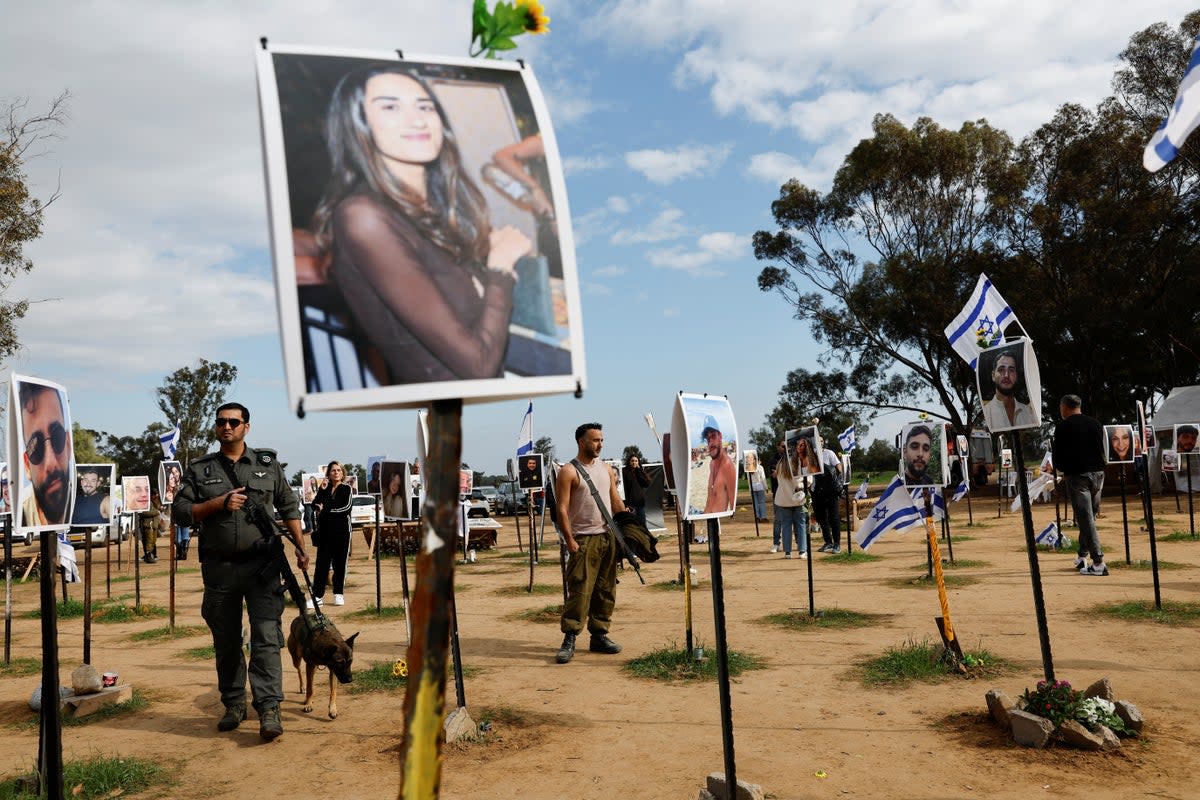 Members of the Israeli military visit the site of the Nova festival, where people were killed and kidnapped during the October 7 attack (REUTERS)