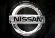 In this April 8, 2019, photo, Nissan logo is seen at the automaker's showroom in Tokyo. Nissan is seeing sales and profits tumble, as its once revered former chairman, Carlos Ghosn, awaits trial on charges of financial misconduct. The Japanese automaker says it is beefing up corporate governance and sticking with its alliance with French partner Renault SA. (AP Photo/Shuji Kajiyama)