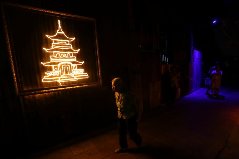 The Wider Image: In old Bangkok, a goddess resists a wave of gentrification