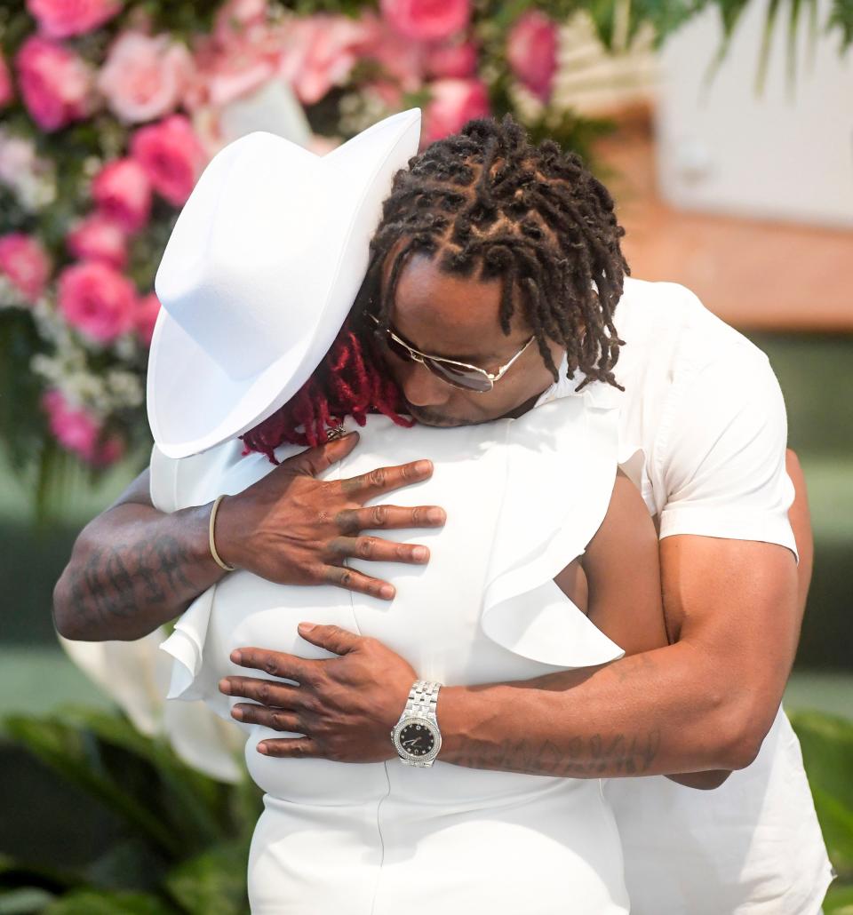 The mother of Shaunkivia ‘Keke’ Smith is hugged during Keke’s funeral at First Baptist Church in Dadeville, Ala, on Saturday April 29, 2023.  Smith was one of the four victims who died in the Dadeville shooting.