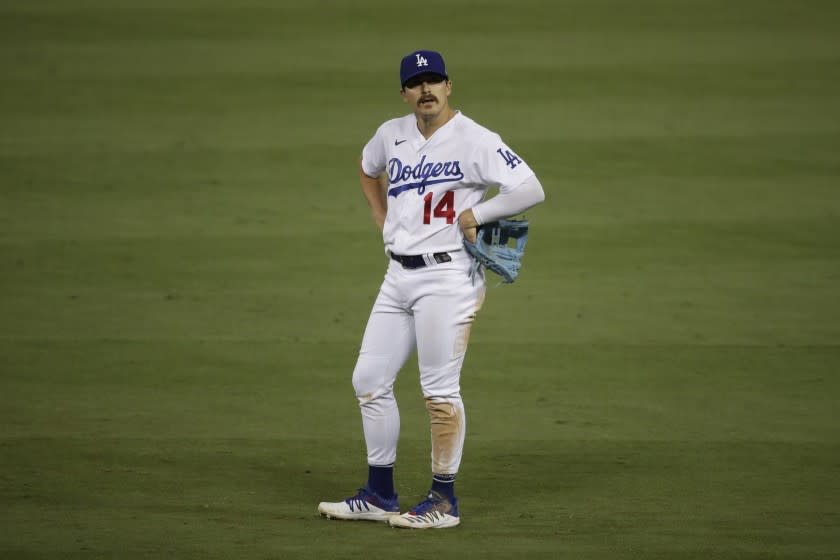 Los Angeles Dodgers' Kiké Hernández stands on the field.