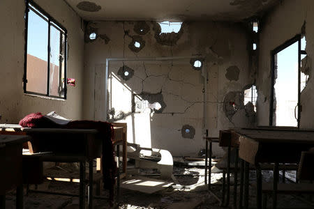 A damaged classroom is pictured after shelling in the rebel held town of Hass, south of Idlib province, Syria October 26, 2016. REUTERS/Ammar Abdullah