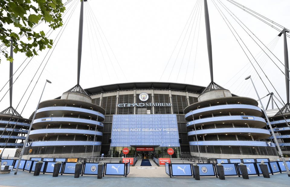 FILE - A exterior shot of the stadium before the English Premier League soccer match between Manchester City and Arsenal at the Etihad Stadium in Manchester, England, Wednesday, June 17, 2020. Manchester City has been accused of numerous breaches of the Premier League's financial regulations between 2009-18. The period covers the first nine full seasons under the club’s Abu Dhabi ownership. City won the league on three occasions during that time in 2012, 2014 and 2018. (Peter Powell/Pool via AP, File)