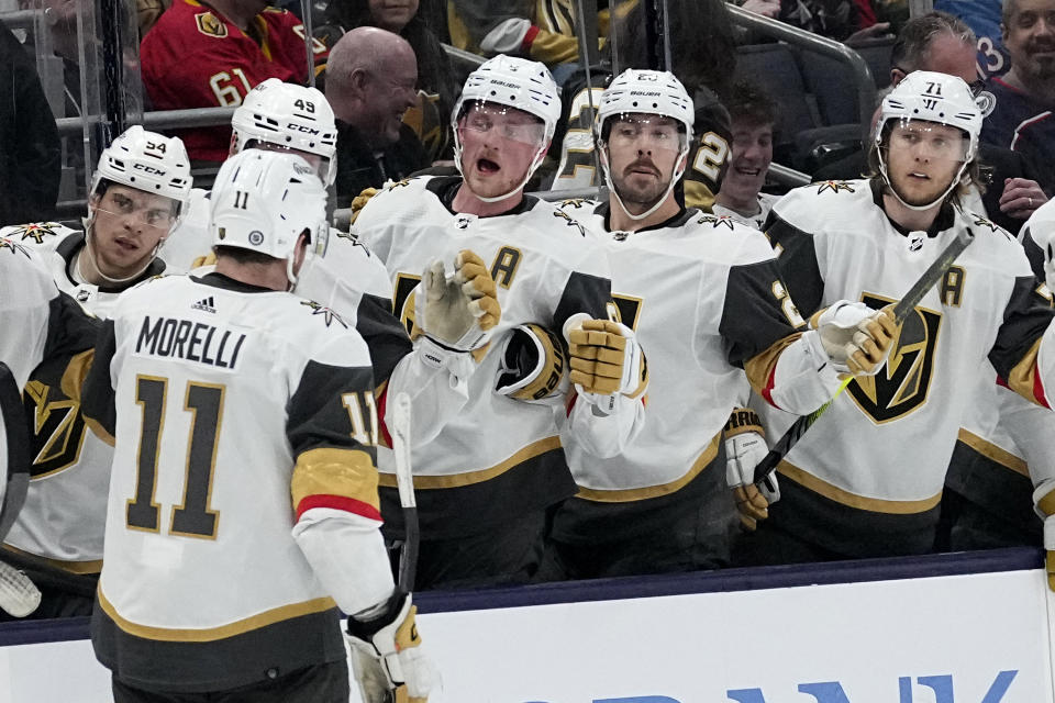 Vegas Golden Knights left wing Mason Morelli (11) celebrates after his goal with teammates in the first period of an NHL hockey game against the Columbus Blue Jackets Monday, March 4, 2024, in Columbus, Ohio. (AP Photo/Sue Ogrocki)