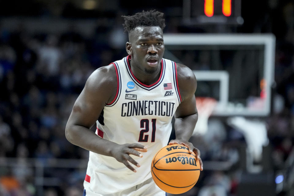 UConn's Adama Sanogo (21) dribbles up the court in the second half of a second-round college basketball game against Saint Mary's in the NCAA Tournament, Sunday, March 19, 2023, in Albany, N.Y. (AP Photo/John Minchillo)