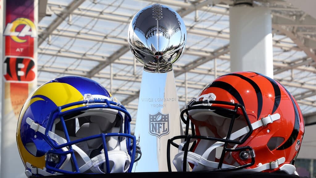 Helmets of the Los Angeles Rams and Cincinnati Bengals sit in front of the Lombardi Trophy on the SoFi Stadium campus in Inglewood, California. (Photo by Rob Carr/Getty Images)