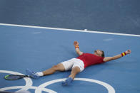 Pablo Carreno Busta, of Spain, reacts after defeating Novak Djokovic, of Serbia, in the bronze medal match of the tennis competition at the 2020 Summer Olympics, Saturday, July 31, 2021, in Tokyo, Japan. (AP Photo/Seth Wenig)