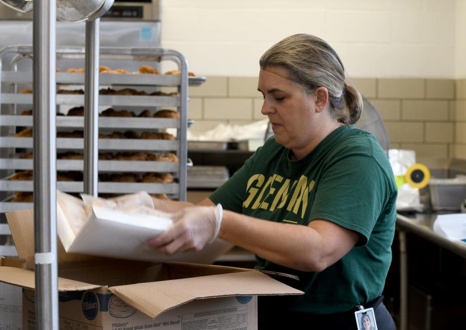 Amy Kozma prepares food in the cafeteria at Plain Local's Barr Elementary School. Because of food shortages and production issues, cafeteria staff across Stark County have had to get scramble to get items to feed students.