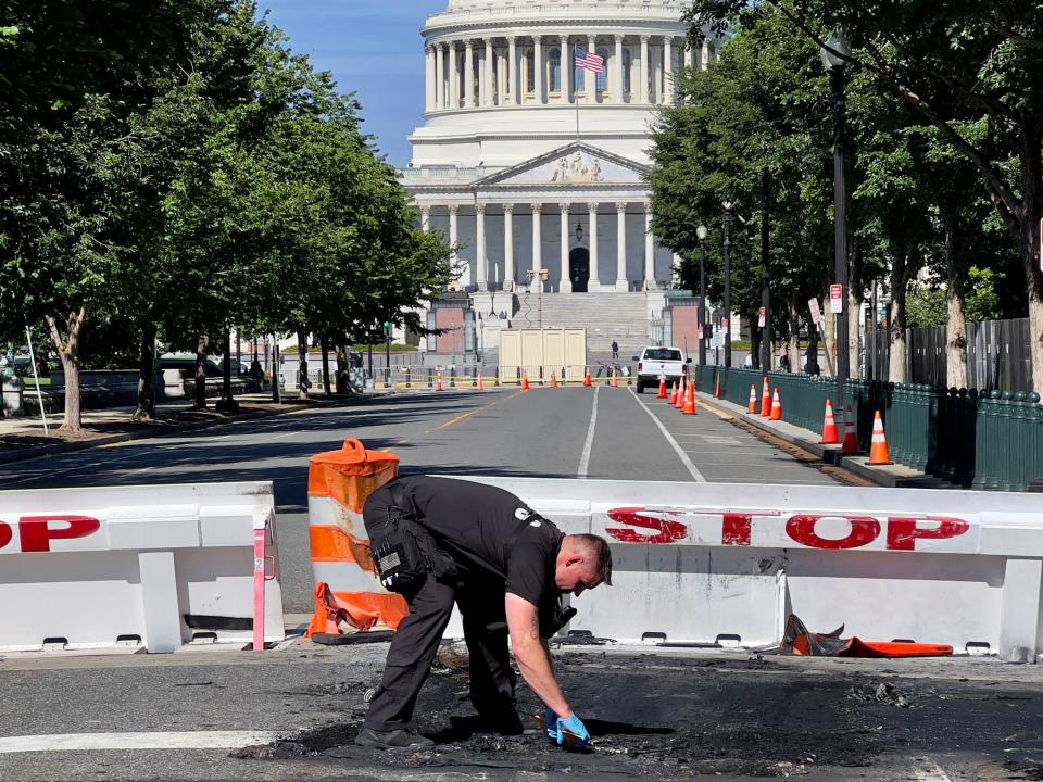 A Capitol Police officer works near a police barricade on Capitol Hill in Washington, D.C., on Aug. 14, 2022. / Credit: DANIEL SLIM/AFP via Getty Images