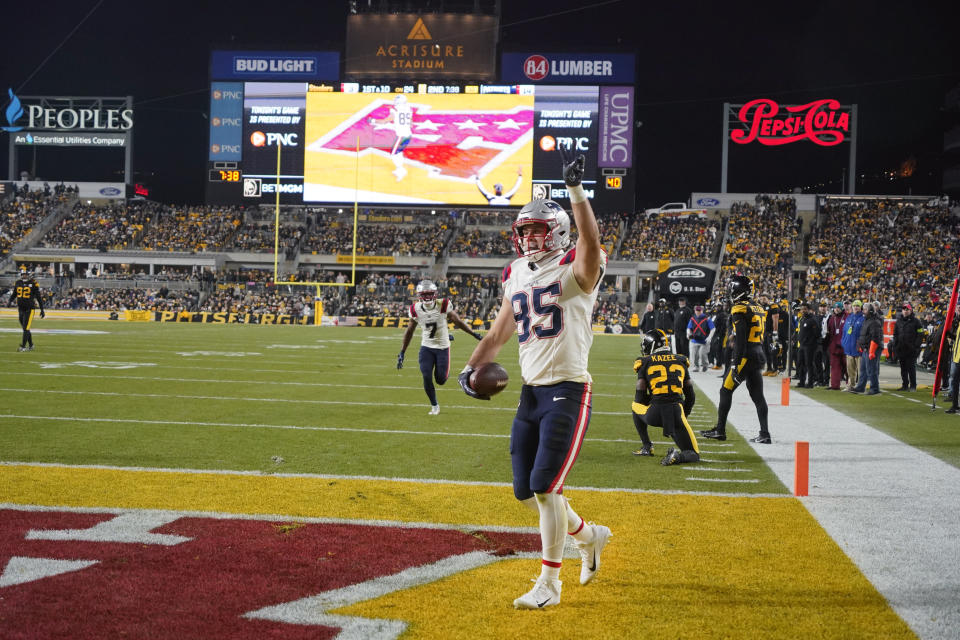 New England Patriots tight end Hunter Henry (85) celebrates after scoring during the first half of an NFL football game on Thursday, Dec. 7, 2023, in Pittsburgh. (AP Photo/Gene J. Puskar)