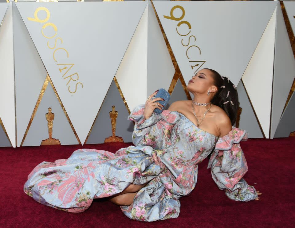 Andra Day ditched tradition and chose to literally pose on the red carpet. Source: Getty