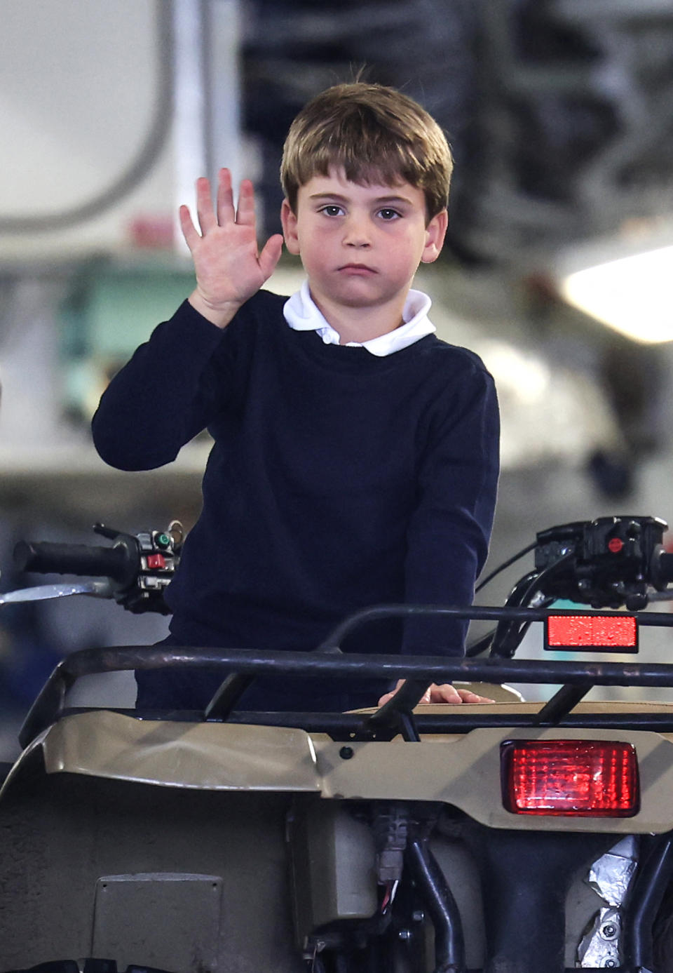 Britain's Prince Louis of Wales waves as he sits inside a vehicle on a C17 plane during a visit to the Air Tattoo at RAF Fairford on July 14, 2023 in Fairford, central England. (Photo by Chris Jackson / POOL / AFP) (Photo by CHRIS JACKSON/POOL/AFP via Getty Images)