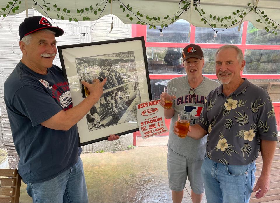 Firestone High School graduates Jess Ennis, left, Randy Clar, center, and Greg Miller, right, attended 10-cent beer night together on June 4, 1974, at Cleveland Stadium. The friends have photographic evidence.