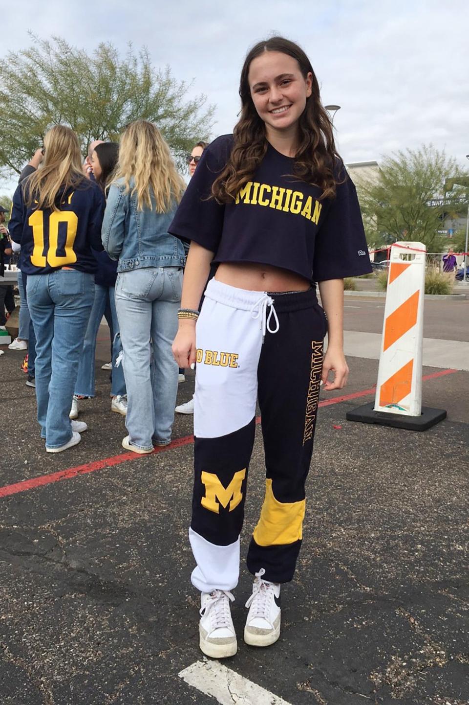 Lexie Morse, daughter of attorney Mike Morse, was the driving force behind their trip to Saturday's Fiesta Bowl. As her wardrobe suggests, she's a major Michigan fan and, she hopes, a future student.