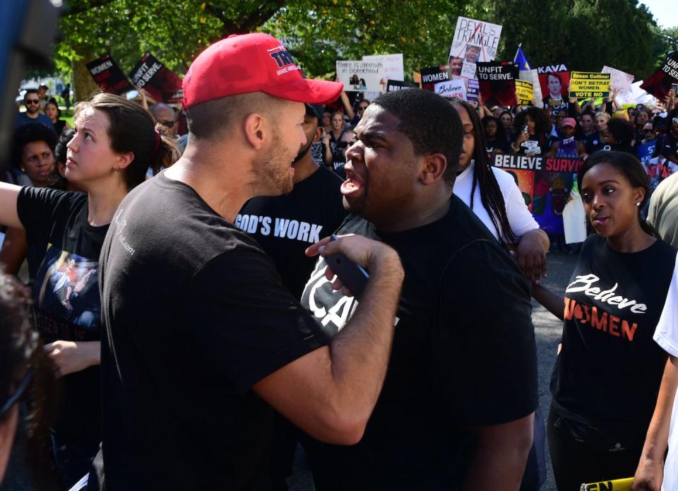 A protester and a supporter of U.S. Supreme Court Justice Brett Kavanaugh argue before his confirmation in 2018. <a href="https://media.gettyimages.com/photos/protester-and-a-supporter-of-us-supreme-court-nominee-brett-kavanaugh-picture-id1045620576" rel="nofollow noopener" target="_blank" data-ylk="slk:Jim Watson/AFP via Getty Images;elm:context_link;itc:0;sec:content-canvas" class="link ">Jim Watson/AFP via Getty Images</a>