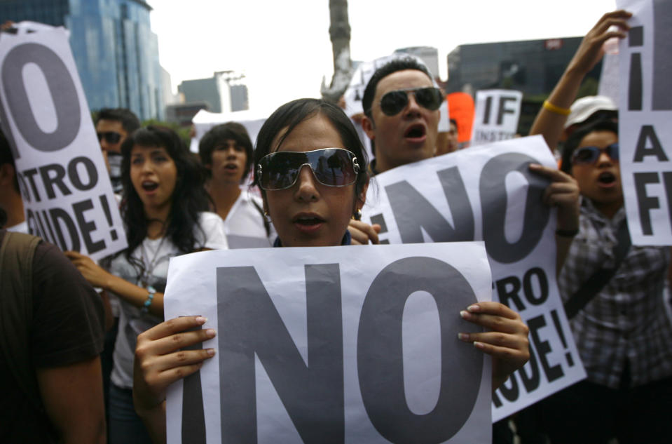 Mexicans unhappy with the presidential election results, march in Mexico City, Saturday, July 7, 2012. The protestors are marching in rejection of the final count in the presidential election showing former ruling party candidate Enrique Pena Nieto as the victor. They believe the PRI engaged in vote-buying that illegally tilted millions of votes. PRI officials deny the charge. (AP Photo/Marco Ugarte)