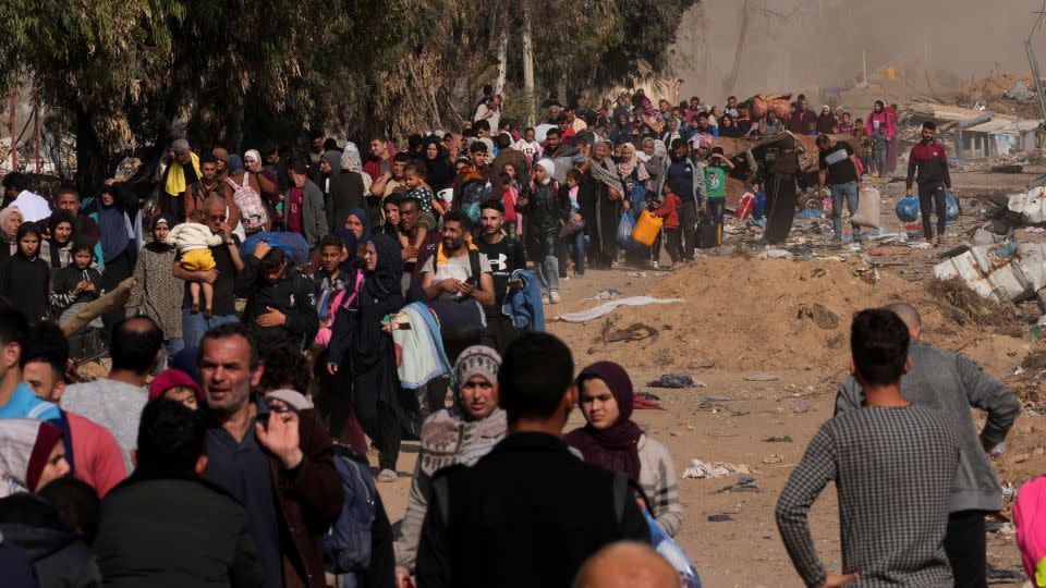 Palestinians flee to southern Gaza along Salah Eddin Street, on the outskirts of Gaza City, during the ongoing Israeli bombardment on Saturday, November 18, 2023. - Adel Hana/AP