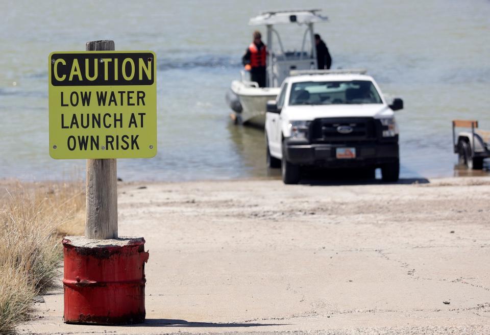 Division of Parks ranger Trent Currie and Steve Bullock, Division of Recreation law enforcement chief with the Utah Department of Natural Resources, load a boat onto a trailer during boat operating training in the Great Salt Lake State Park marina in Magna on Wednesday, April 19, 2023. | Kristin Murphy, Deseret News