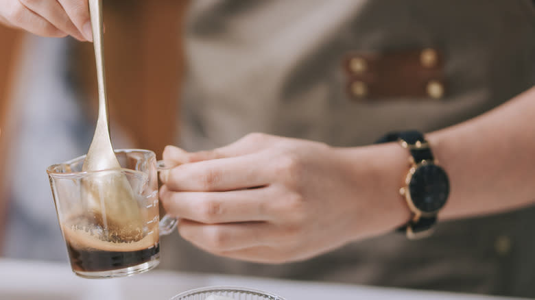 Mixing coffee with water