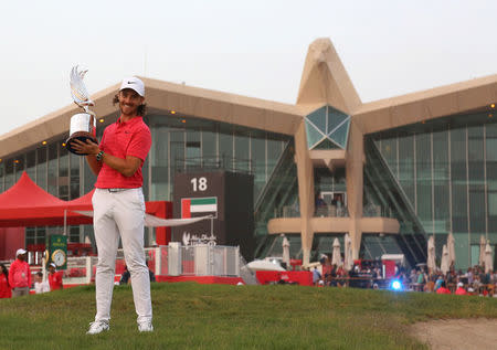 Golf - European Tour - Abu Dhabi HSBC Championship - Abu Dhabi Golf Club, Abu Dhabi, UAE - January 21, 2018 - England's Tommy Fleetwood poses with the trophy. REUTERS/Satish Kumar