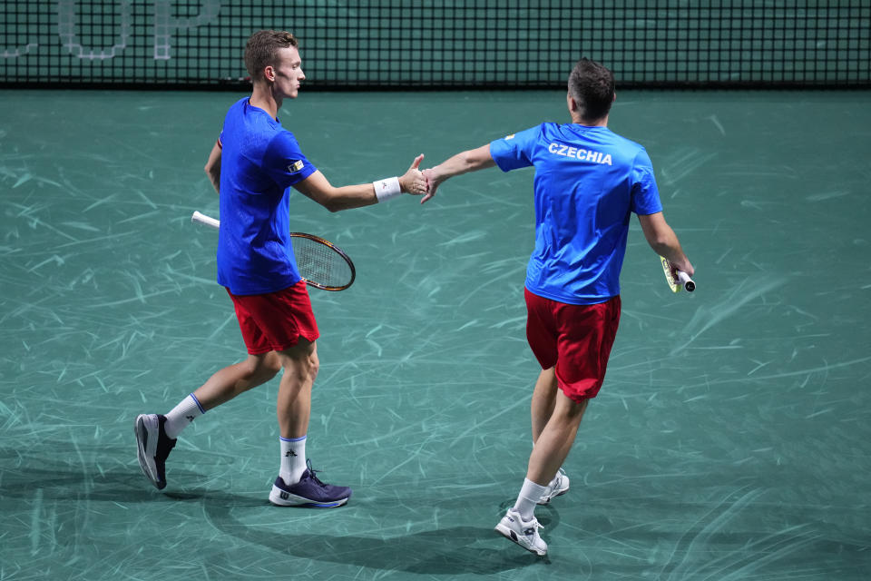 Jiri Lehecka of the Czech Republic, left, and Adam Pavlasek of the Czech Republic react during a Davis Cup quarter-final tennis match against Australia's Matthew Ebden and Australia's Max Purcell in Malaga, Spain, Wednesday, Nov. 22, 2023. (AP Photo/Manu Fernandez)