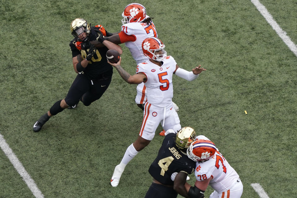 Clemson quarterback DJ Uiagalelei (5) looks to pass against Wake Forest in Winston-Salem, N.C., Saturday, Sept. 24, 2022. (AP Photo/Chuck Burton)