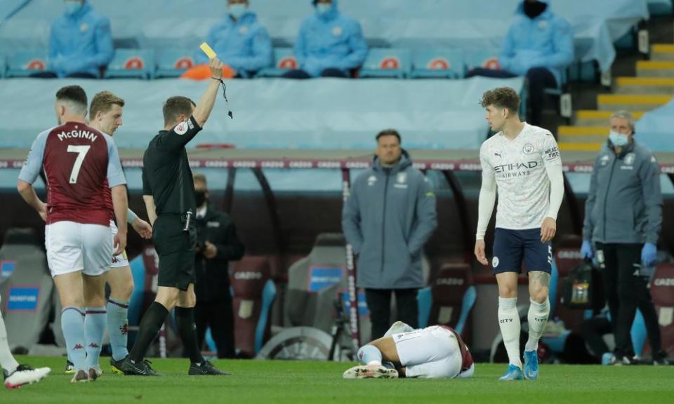 John Stones receives a yellow card before it was changed to a red