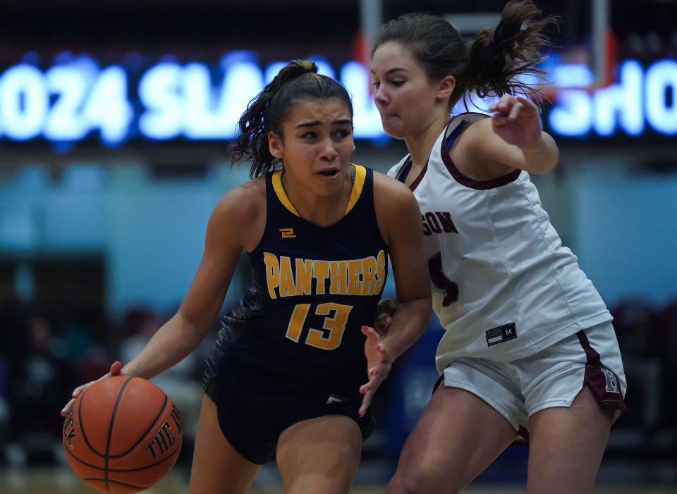 Panas' Sofia Tavarez (13) works against Harrison's Brianna Gonzalez (5) during the Slam Dunk Showcase at the Westchester County Center in White Plains on Saturday, Jan. 6, 2024.