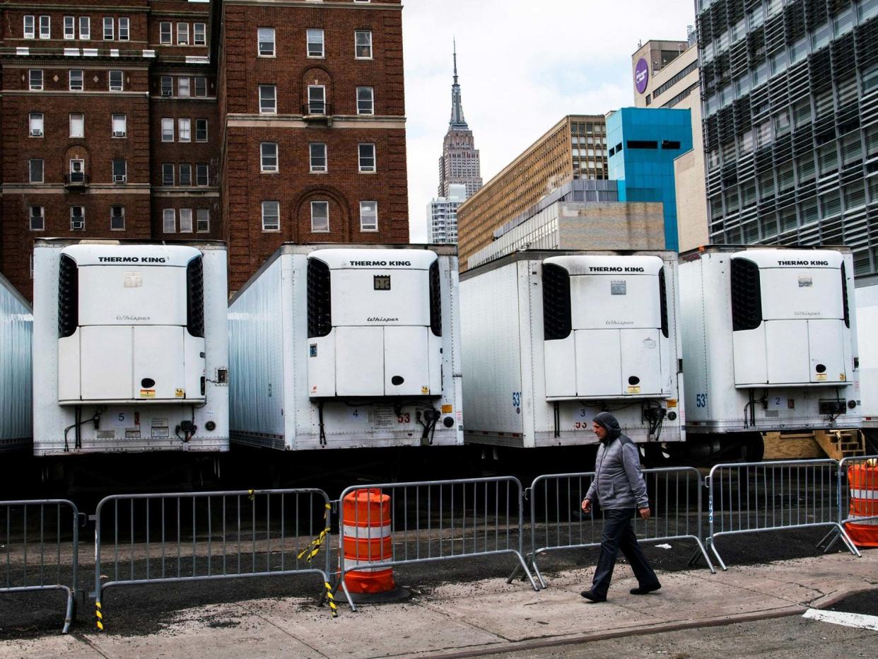 Refrigeration units used as morgues in New York, where deaths in the state account for 40% of the US total: REUTERS