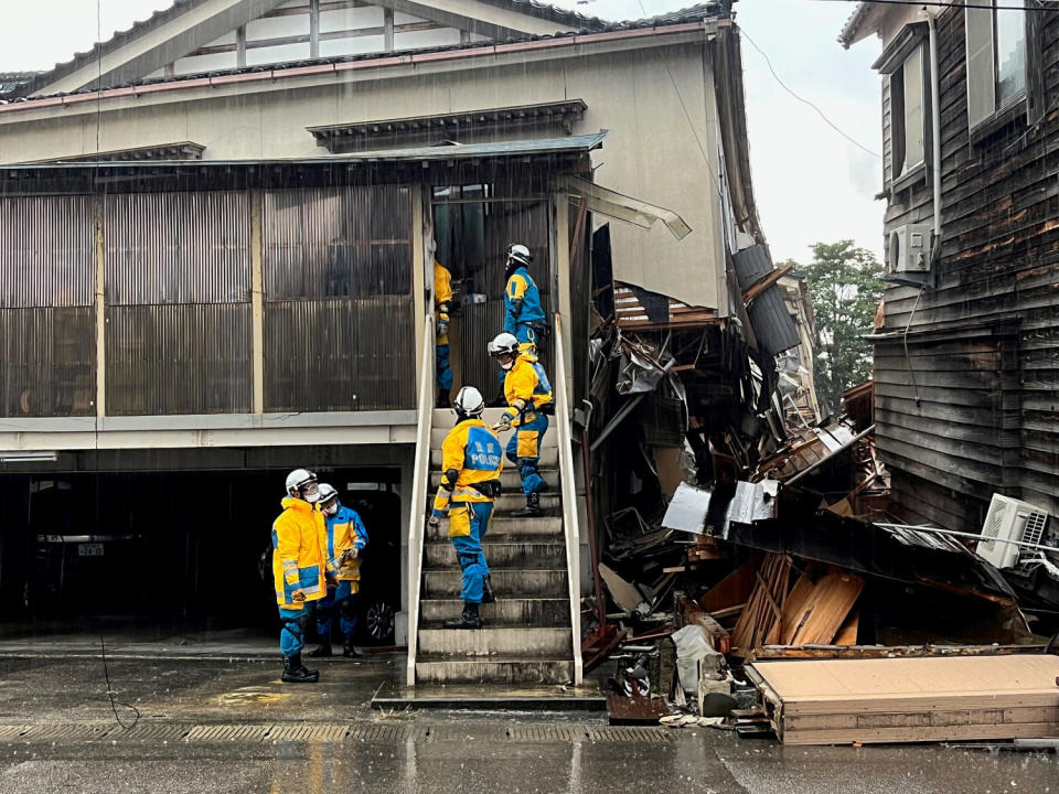 In Wajima, search and rescue crews went door-to-door to checking damaged houses for survivors or bodies.  (Janis Mackey Frayer)